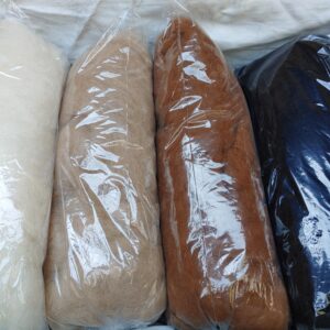 White, light fawn, medium brown and black alpaca fibre for spinning